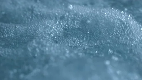Beautiful macro shot of small and big air bubbles in water rising in slow motion Stock Footage 167938665