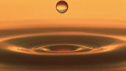 Beautiful macro slow motion water drop orange Stock Footage 158248448