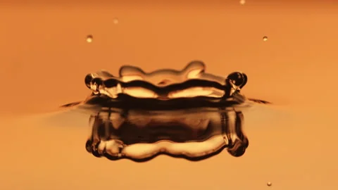 Beautiful macro slow motion water drop orange Stock Footage 158322812