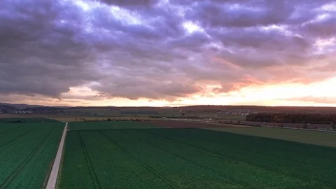 Beautiful magic Cloudy Sunset with Horizon red burning sky clouds over field 動画素材 122401725