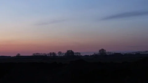 Beautiful magical landscape image with trees silhouette at sunset. Stock Footage 74541566