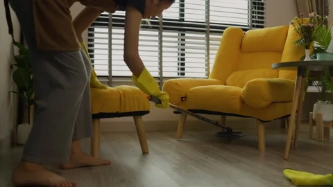 A beautiful maid is getting ready to clean the house, a maid is getting ready to Stock Footage 296670117