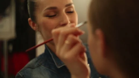 Beautiful make-up artist doing makeup Stock Footage 35628049