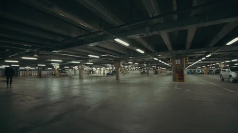 Beautiful man goes somewhere in the Parking lot 스톡 동영상 56272819