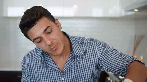 The beautiful man is salad in the kitchen Stock Footage 100576172