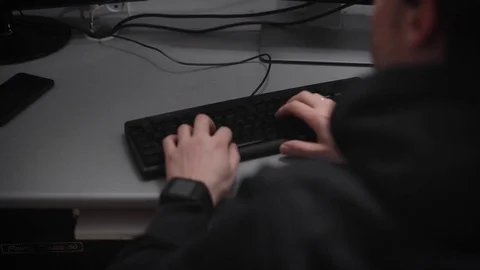 Beautiful man's hands with a black clock fast typing text, typing different Stock Footage 72406060