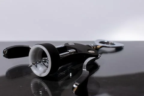 Beautiful, matte black corkscrew on the table Stock Photos