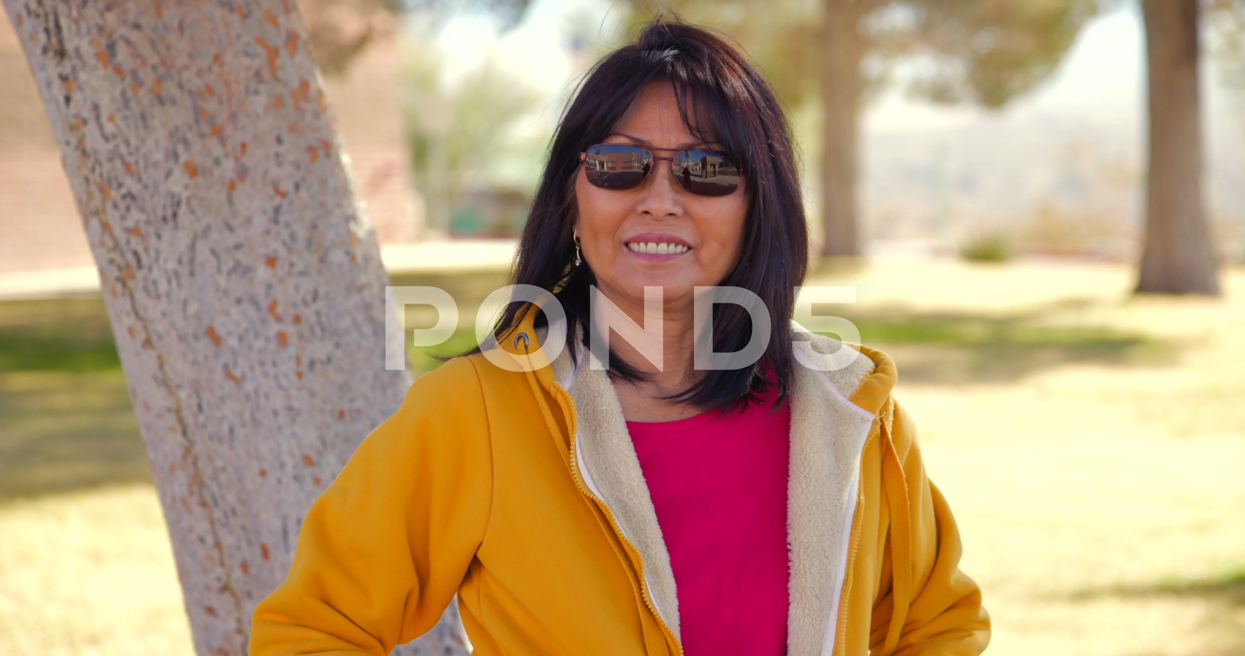 Beautiful mature asian woman in sunglass... | Stock Video | Pond5