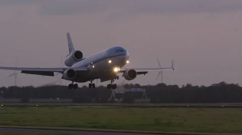 Beautiful MD-11 plane 'threeholer' touching down at the runway. Stock Footage 40191797