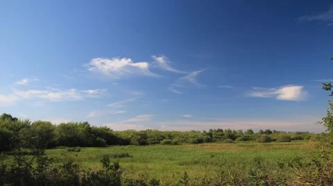 Beautiful meadow landscape with moving clouds on the sky. Time lapse in full HD Vídeos de archivo 53497760