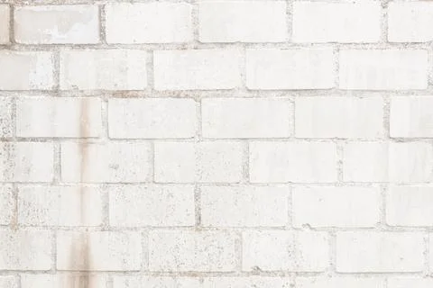 A beautiful medium shot of the texture of light, greyish-white brickwork. Stock Photos