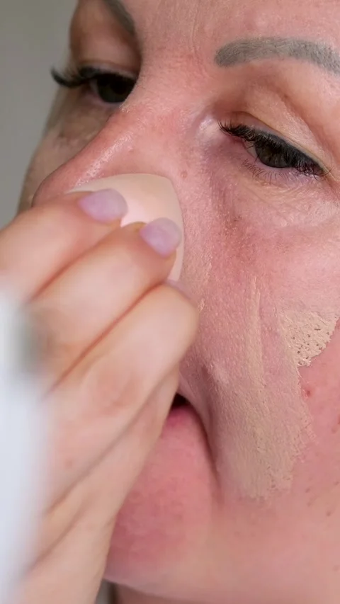Beautiful middle-aged 50s old lady mature woman applying powder luxury cosmetics Stock-Footage 287834793