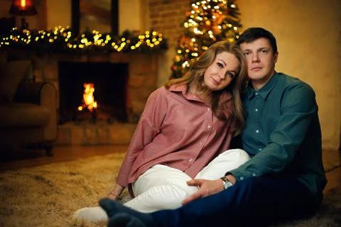 Beautiful middle aged couple posing in christmas interior Stock Photos