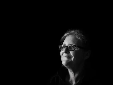 A beautiful middle aged lady posing for the camera Stock Photos