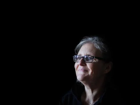 A beautiful middle aged lady posing for the camera Stock Photos