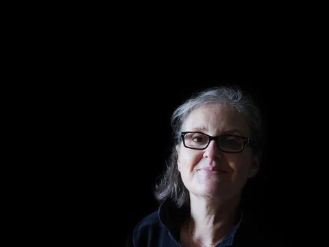 A beautiful middle aged lady posing for the camera Stock Photos