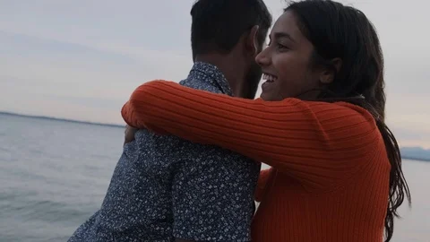 Beautiful middle eastern couple dancing by the ocean Stock Footage 111977109