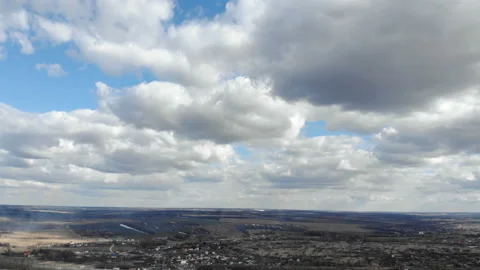 Beautiful mighty clouds hovering above the ground. Panorama. Stock Footage 106290130