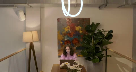 Beautiful millennial digital nomad working remotely on laptop computer. Stock Footage 156778411
