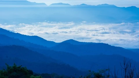 Beautiful Mist Floating Around Valleys 4K Time Lapse (tilt up) Stock Footage 101189812