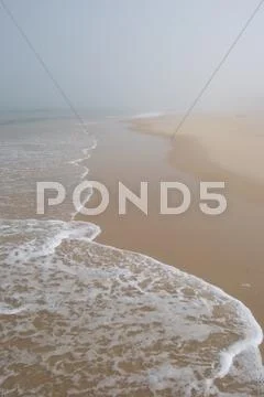 Beautiful misty beach Stock Photos