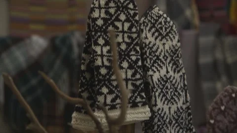 Beautiful mittens on the background of patterned blankets Stock Footage 251846186