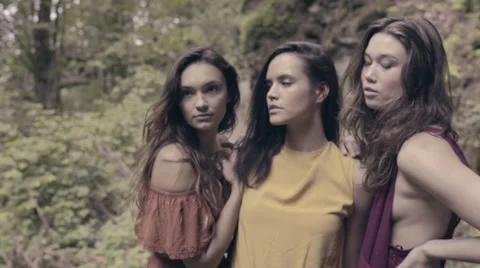 Beautiful Mixed Race Models Pose In Lush Forest, Then They Laugh (Slow Motion) Video stock 56047694