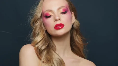 Beautiful model with bright makeup and r... | Stock Video | Pond5