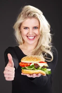 Beautiful model with Burger Stock Photos