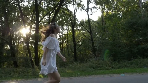 Beautiful model dressed in romantic beautiful white dress having photo shooti Stock Footage 83143527