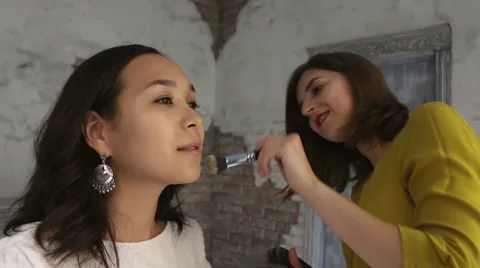 Beautiful model gets a professional makeup done by a visagist. Super video Stock Footage 65207215