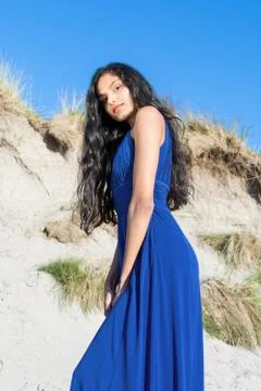 Beautiful model looking down at camera at the beach in Sligo in Ireland. Stock Photos