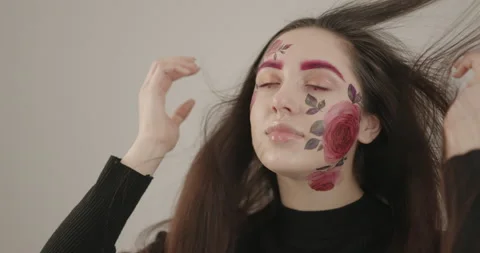 Beautiful model posing for the camera in the studio playing with her hair and Stock-Footage 159506342