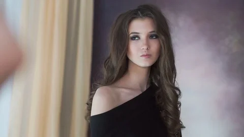 Beautiful model posing on photosession in studio. Stock Footage 74122228