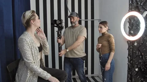 Beautiful Model Posing for a Video Clip, Cameraman Filming Her. Stock Footage 148546975