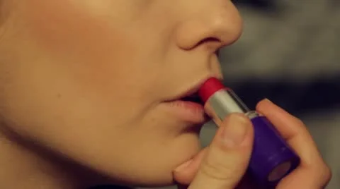 Beautiful model put make up-lips stick-extreme close up-. Stock Footage