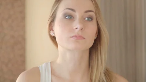 Beautiful model putting face cream in bathroom 스톡 동영상 72123316