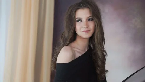 Beautiful model smiling on photosession in studio. Stock Footage 74121801