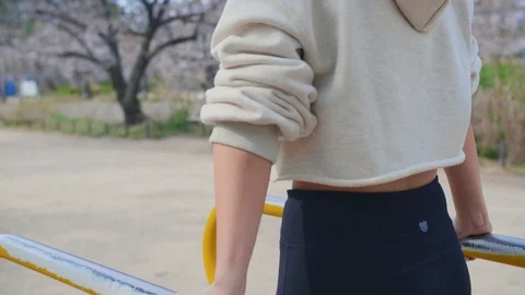 Beautiful model stretching in Park workout Japan Stock Footage 105638998
