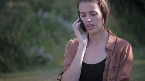 Beautiful model talking on smartphone - medium shot Stock Footage 34514106