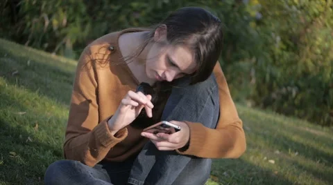 Beautiful model using a smart phone - canted-angle shot Stock Footage 40292662