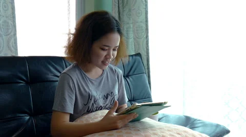 Beautiful Model using Tablet Computer Touchscreen Stock Footage 65403146