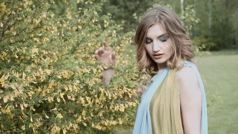Beautiful model on vacation in the forest. Slow motion. HD Stock Footage 76295497