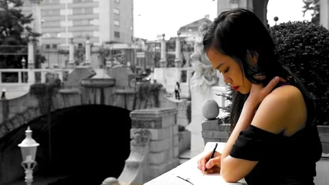 Beautiful model writing notes in journal, before classical architecture Video stock 269353817