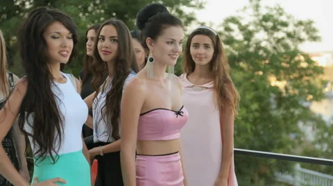 Beautiful models posing on the veranda of of the restaurant Stock Footage 59657528