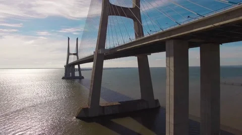 Beautiful modern bridge over the river aerial view Stock Footage