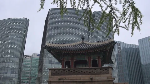 Beautiful modern tower facade and vintage building design in Seoul downtown day Stock Footage 85761434
