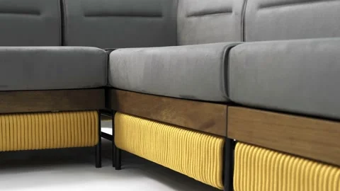 Beautiful modular sofa with wood sides and gray silk textile cushions. Stock Footage 219583126