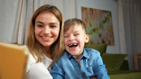 Beautiful mom and son making selfie at home. Happy family concept Stock Footage 124860188