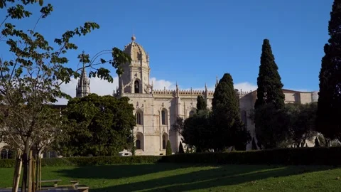 Beautiful Monastery revealed from behind a tree at sunrise in Lisbon Portuga Stock Footage 274530869